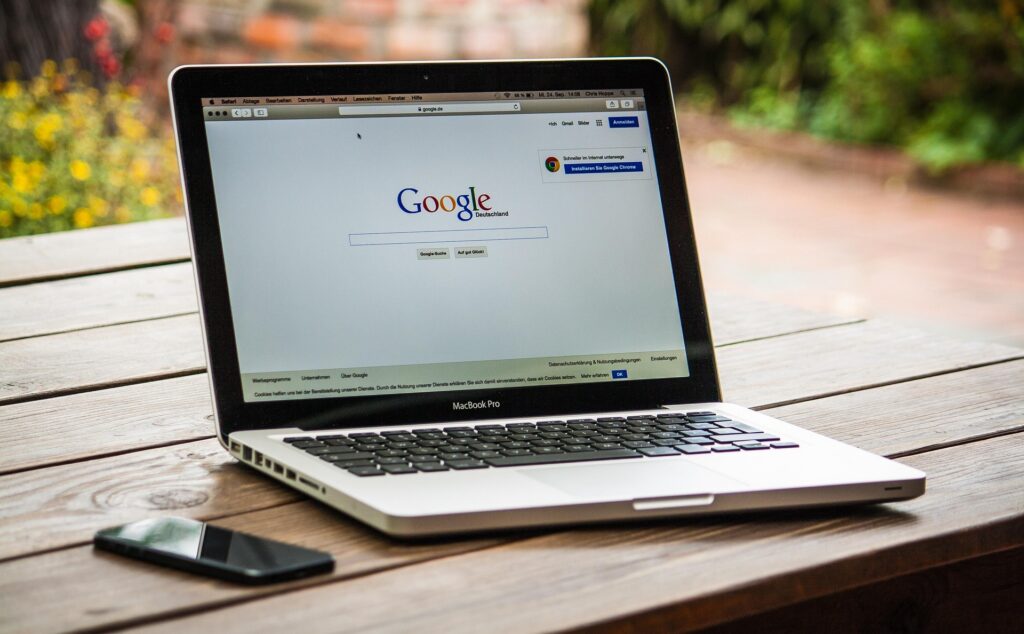 Google Ads search page on a laptop representing search engine advertising for law firms.