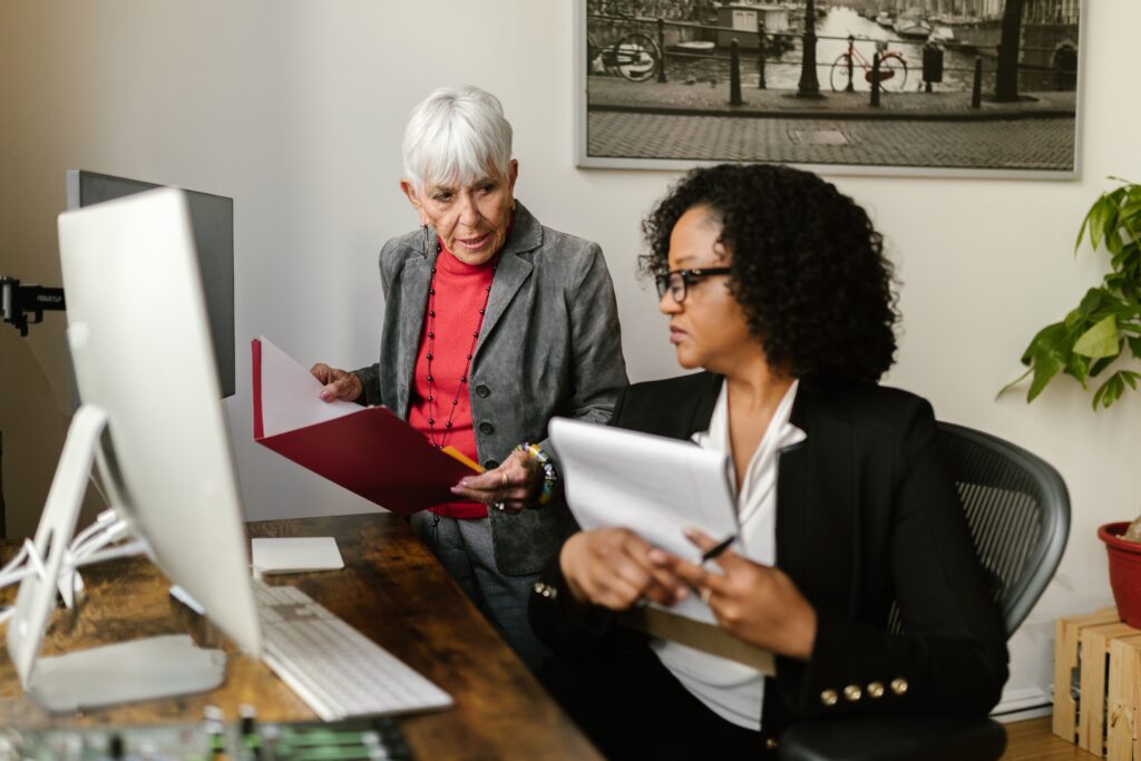 Law firm professionals reviewing campaign documents and Google Ads lead generation performance.