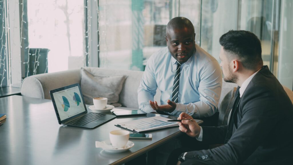 Marketing consultants discussing Google Ads strategy and advertising performance for business growth.